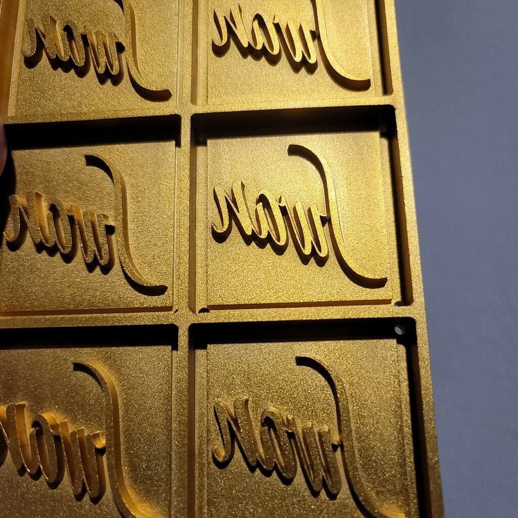 Gold painted CNC routed panels with raised script lettering