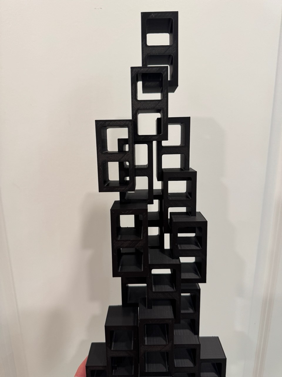 Tall black geometric cube stack sculpture