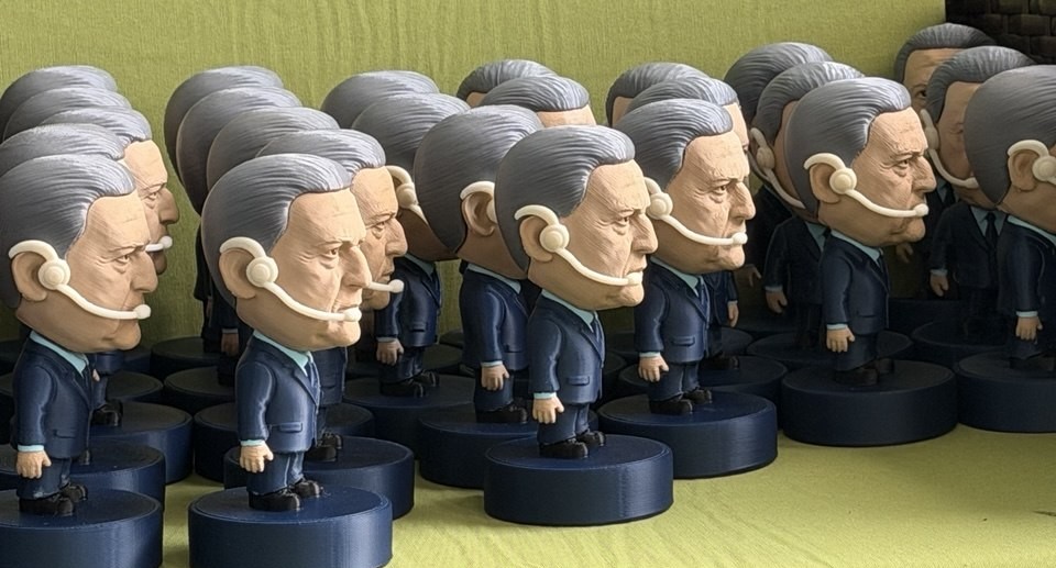 Batch of custom 3D printed character figurines with headsets