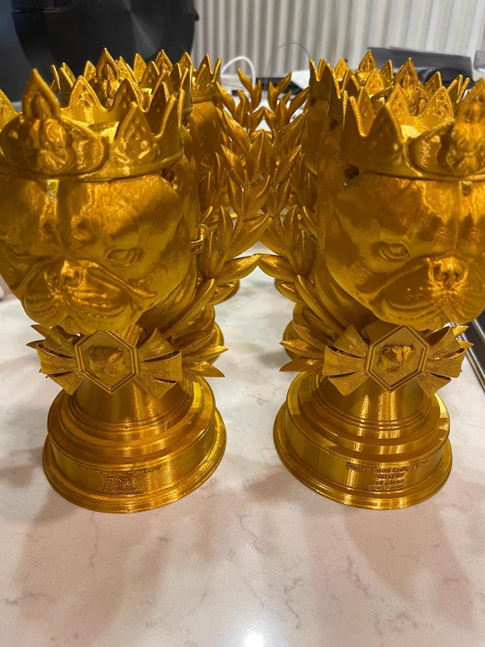 Custom gold-finished 3D printed bulldog trophies