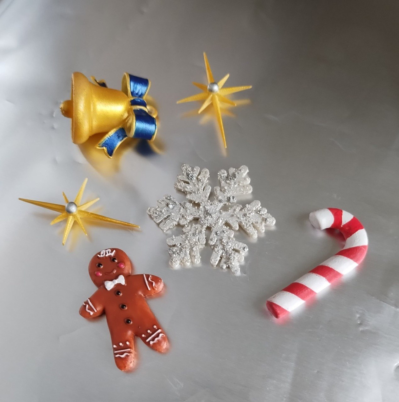 Custom 3D printed holiday ornaments, bell, stars and snowflake