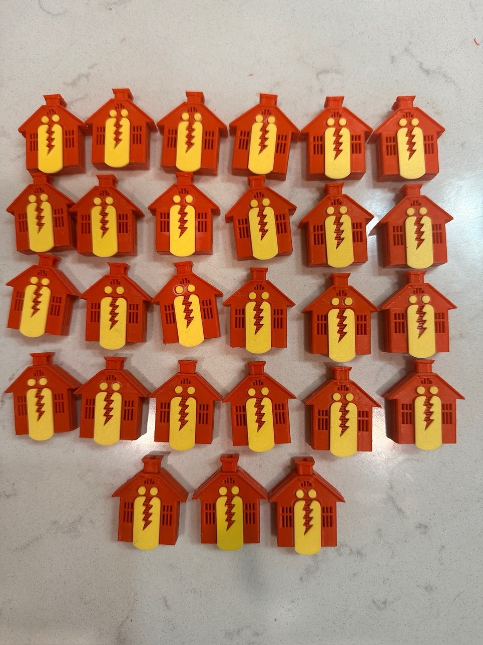Batch of custom 3D printed house-shaped game tokens