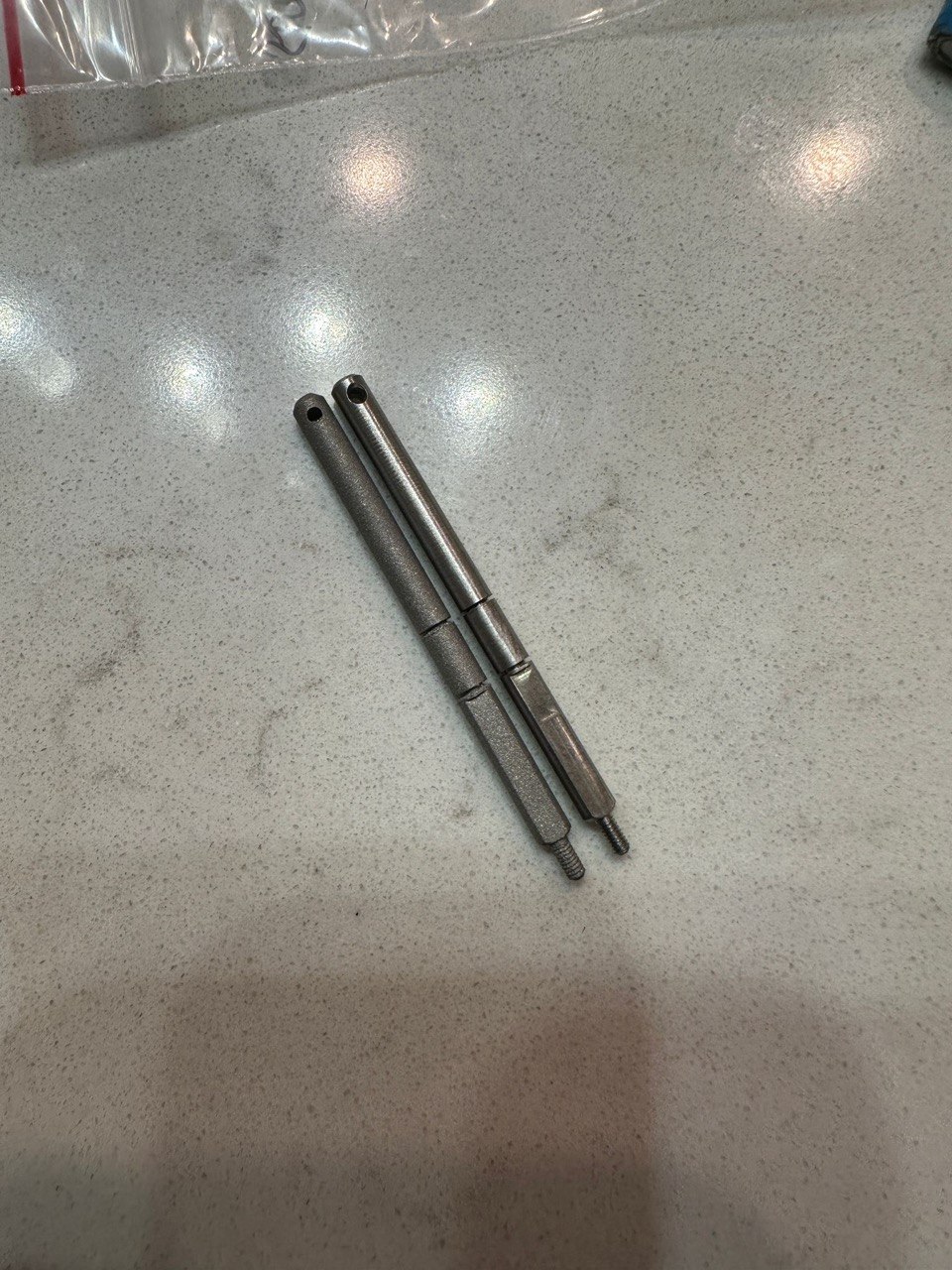 Two SLM metal printed stainless steel threaded push rods