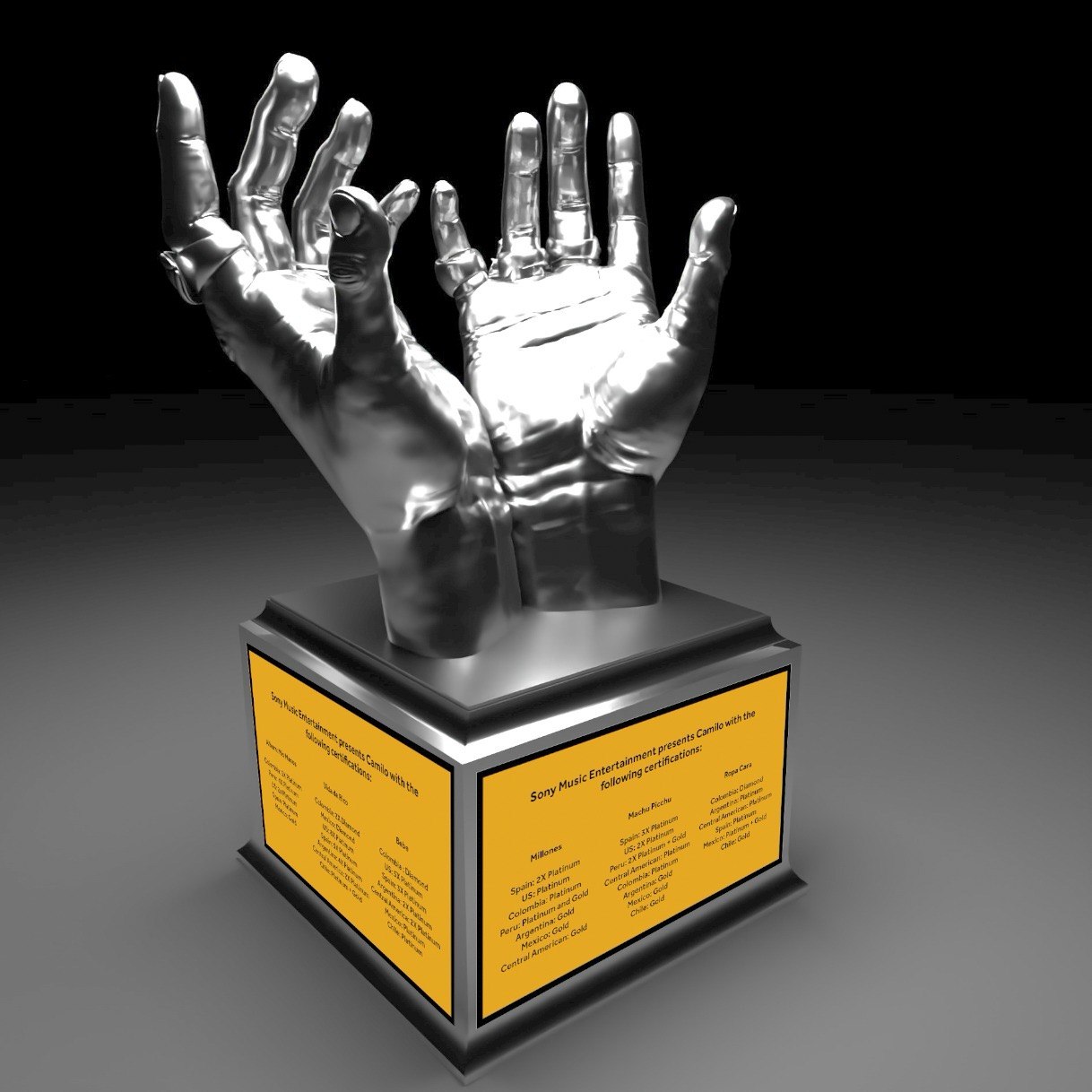 Chrome cupped-hands award on a gold plaque base