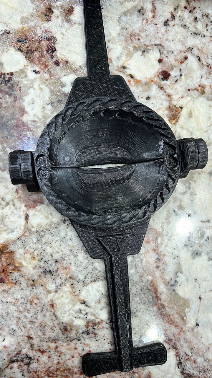Finished 3D printed axle cover with rope-twist trim