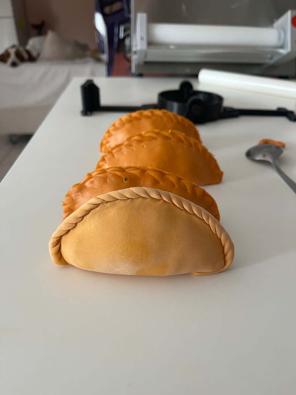 Real empanadas used as the reference object for a custom mold