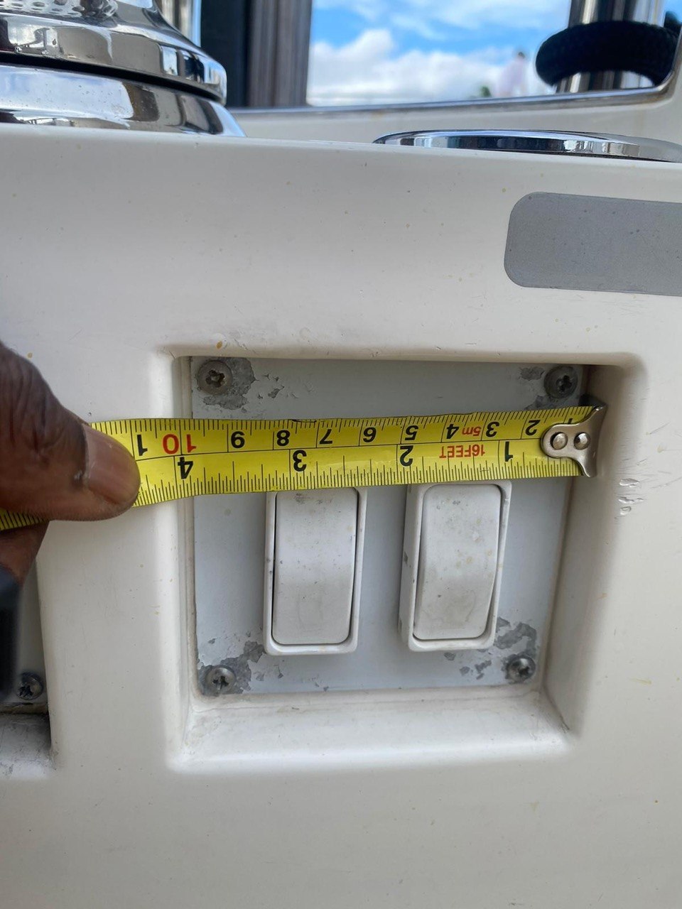 Tape measuring a boat helm rocker switch panel opening