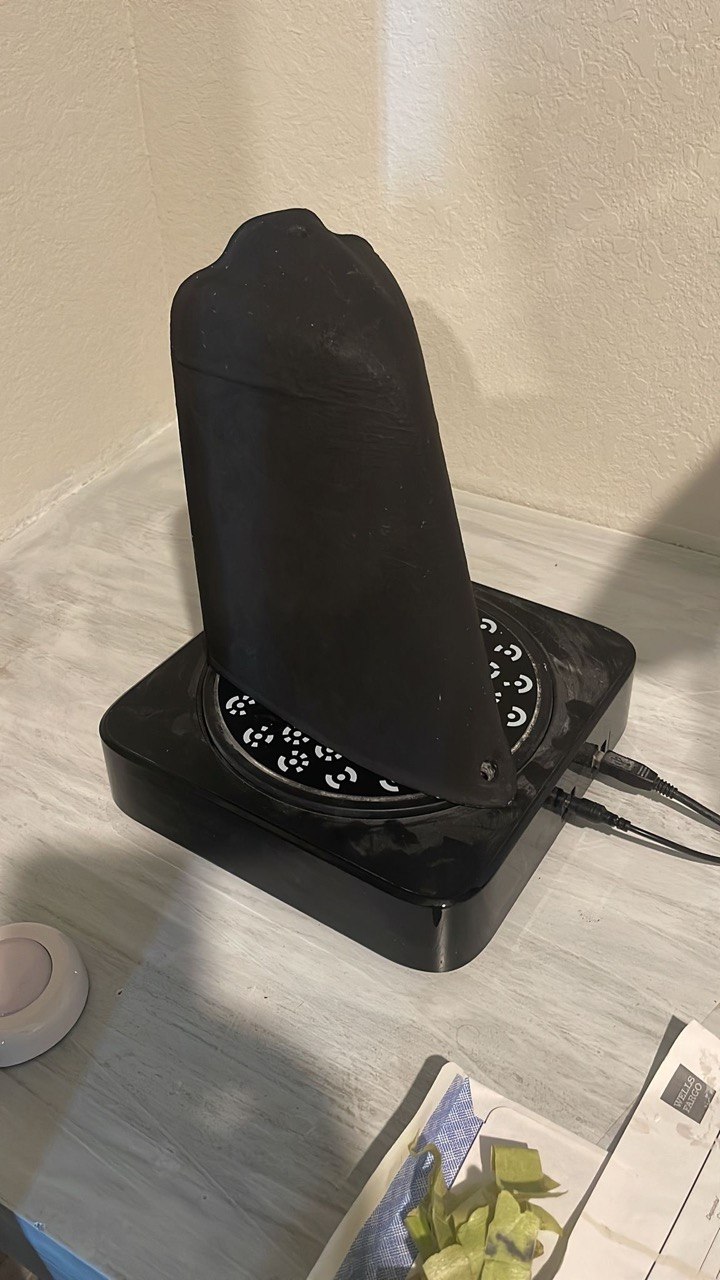 Part mounted on a 3D scanning turntable with fiducial markers