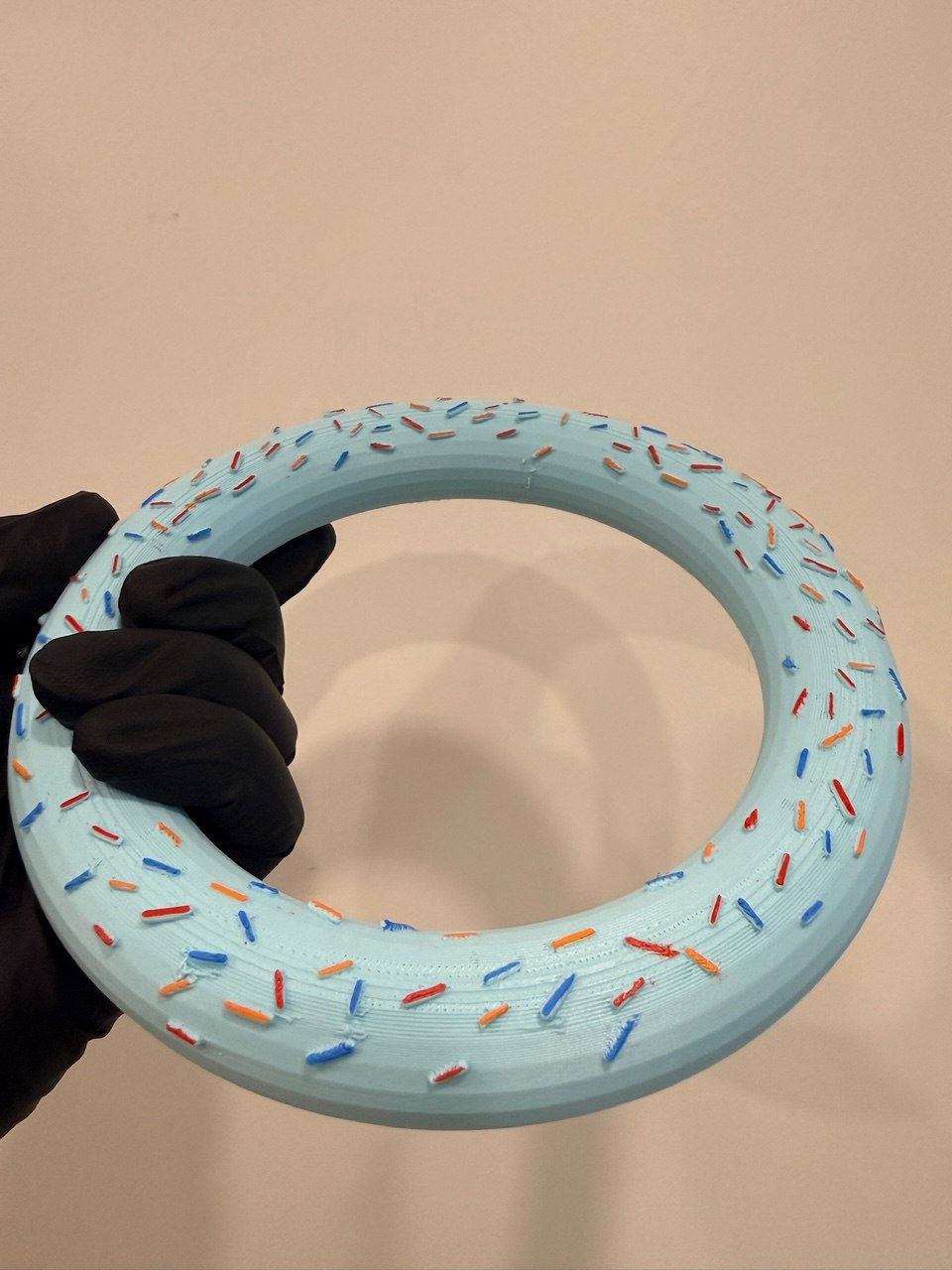 3D printed novelty donut ring with colorful sprinkles